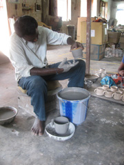 Artisan from Pondicherry Applying Second Layer of Clay to a Ceramic Mug SIPA-Ceramics-Artisan-3