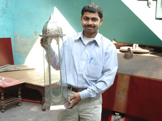 Anwar Saleem shows off a lantern he has made