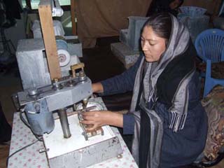 For stones that need holes, they use a drill press