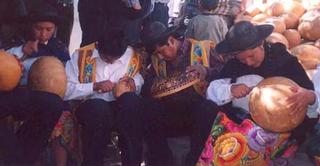 Esperanza Antu Carving Gourds in Traditional Dress during a Local Festival in Cochas Chico